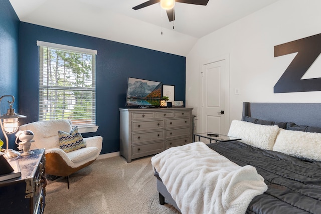 221 Sky Top Dr, Montgomery, TX 77316 - bedroom with light carpet, multiple windows, lofted ceiling, baseboards, and ceiling fan