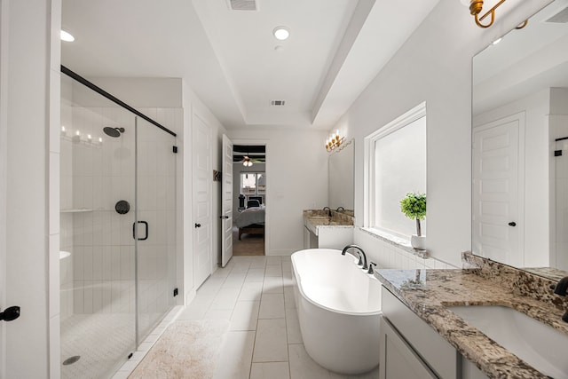 31207 Hastings Creek Ln, Fulshear, TX 77441 - ensuite bathroom featuring a freestanding tub, a stall shower, vanity, ceiling fan, and tile patterned floors