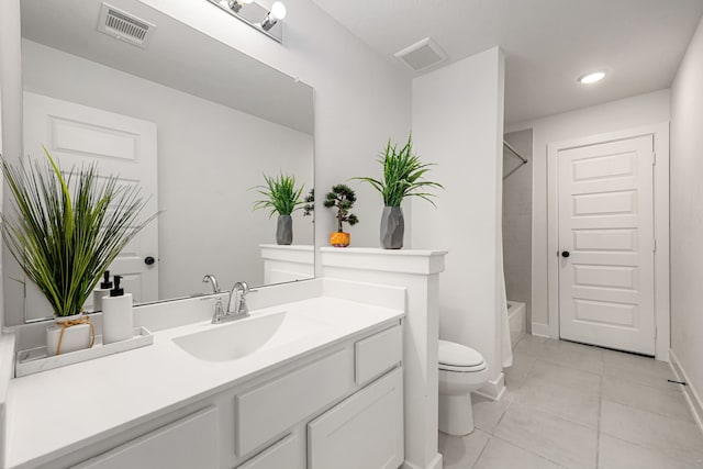 31207 Hastings Creek Ln, Fulshear, TX 77441 - bathroom with tile patterned flooring, toilet, vanity, recessed lighting, and washtub / shower combination