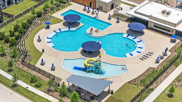 31207 Hastings Creek Ln, Fulshear, TX 77441 - community pool featuring a water play area and a patio
