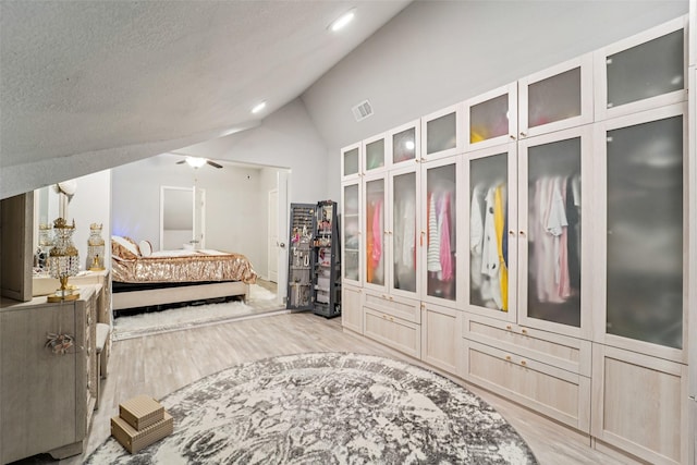 129 S Bearkat Ct, Montgomery, TX 77316 - bedroom featuring wood finished floors, lofted ceiling, and recessed lighting
