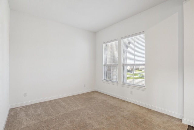 40805 Iver Ln, Magnolia, TX 77354 - spare room with light colored carpet and baseboards