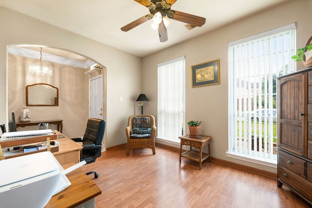 4907 Sienna Heights Ln, Pasadena, TX 77505 - office area with arched walkways, light wood-type flooring, ceiling fan, and baseboards