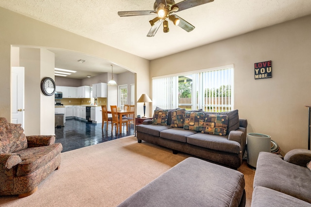 4907 Sienna Heights Ln, Pasadena, TX 77505 - living area featuring arched walkways and a ceiling fan