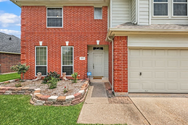 4907 Sienna Heights Ln, Pasadena, TX 77505 - view of front of property featuring brick siding, driveway, an attached garage, and a shingled roof