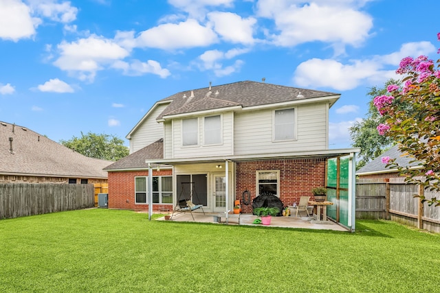 4907 Sienna Heights Ln, Pasadena, TX 77505 - back of house with brick siding, roof with shingles, a patio area, and central AC