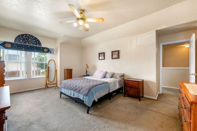 4907 Sienna Heights Ln, Pasadena, TX 77505 - carpeted bedroom with baseboards, a ceiling fan, and a textured ceiling