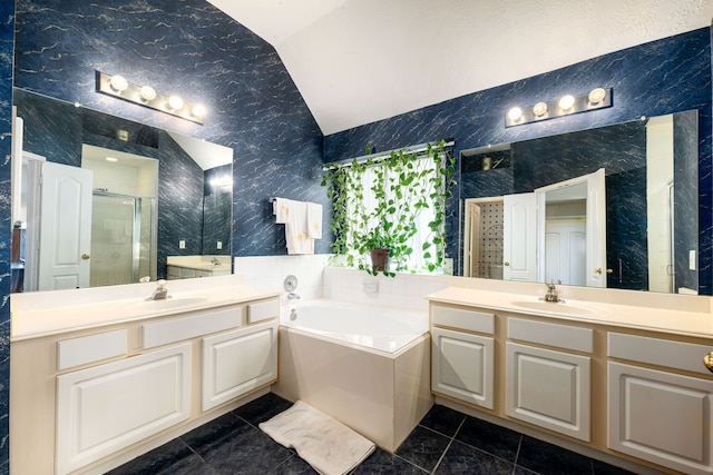 4907 Sienna Heights Ln, Pasadena, TX 77505 - bathroom featuring a shower stall, lofted ceiling, a garden tub, two vanities, and marble finish floors
