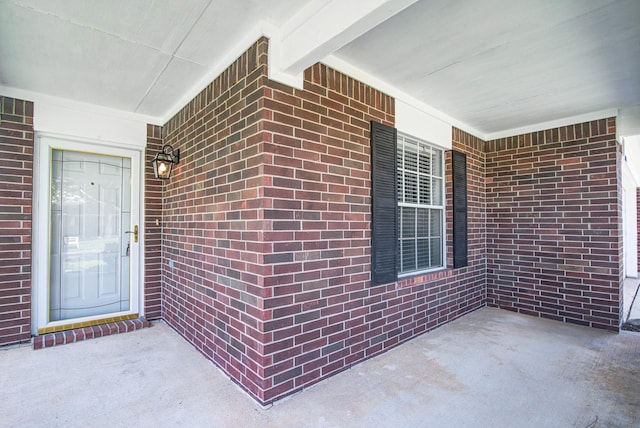 3403 Wheatfield Ct, Pearland, TX 77581 - doorway to property featuring covered porch and brick siding