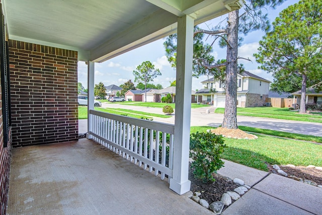 3403 Wheatfield Ct, Pearland, TX 77581 - porch with a residential view and a lawn