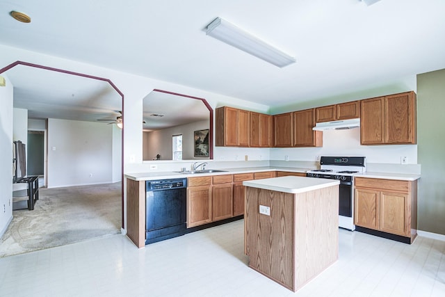3403 Wheatfield Ct, Pearland, TX 77581 - kitchen featuring dishwasher, gas range, a sink, under cabinet range hood, and light countertops