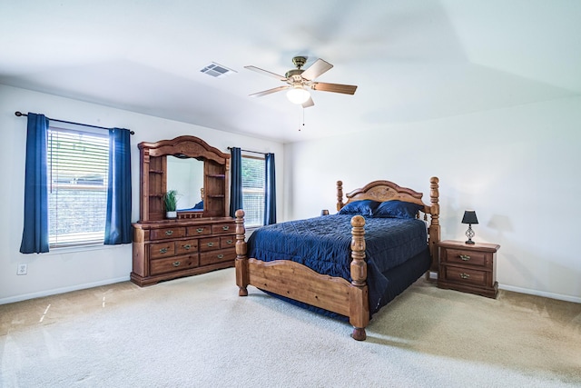 3403 Wheatfield Ct, Pearland, TX 77581 - carpeted bedroom with multiple windows, baseboards, and a ceiling fan