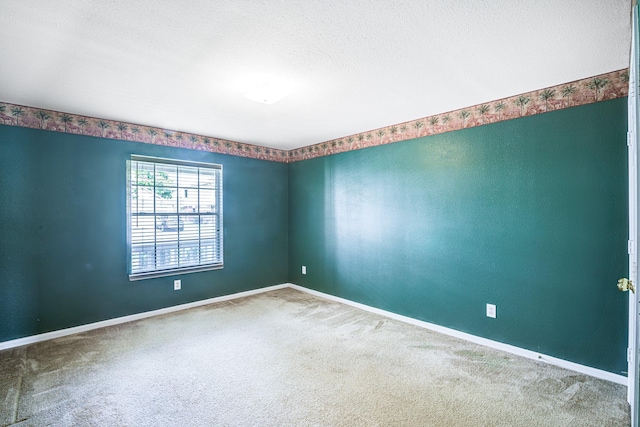 3403 Wheatfield Ct, Pearland, TX 77581 - empty room featuring carpet floors, baseboards, and a textured ceiling
