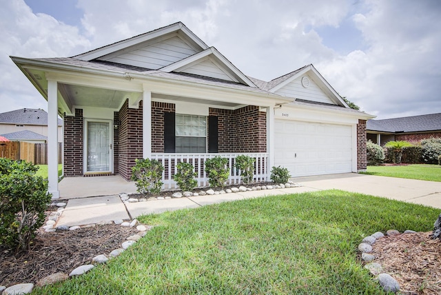3403 Wheatfield Ct, Pearland, TX 77581 - view of front of house with covered porch, brick siding, an attached garage, and concrete driveway