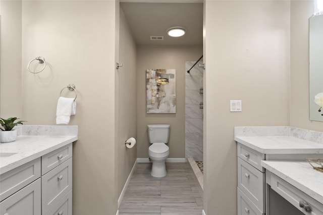 137 Litchfield Ln, Houston, TX 77024 - full bath with toilet, vanity, tiled shower, and baseboards