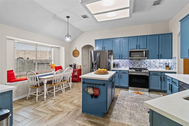 5523 Waverdale Ct, Sugar Land, TX 77479 - kitchen featuring stainless steel appliances, blue cabinetry, arched walkways, light countertops, and backsplash