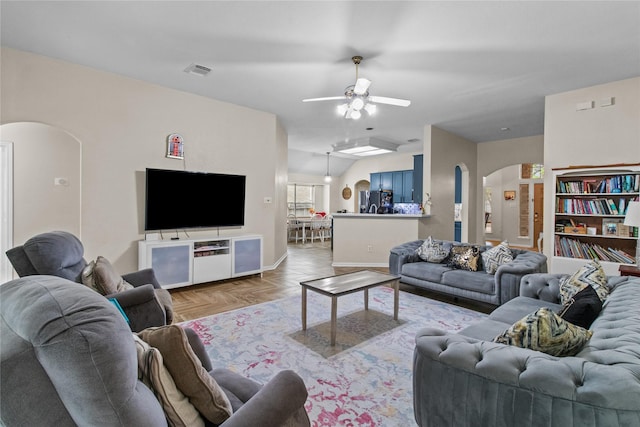 5523 Waverdale Ct, Sugar Land, TX 77479 - living area with arched walkways, ceiling fan, and baseboards