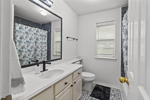 5523 Waverdale Ct, Sugar Land, TX 77479 - bathroom with healthy amount of natural light, vanity, toilet, and tile patterned floors
