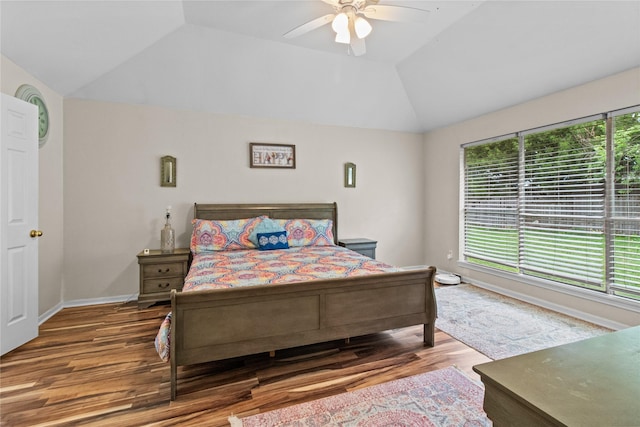 5523 Waverdale Ct, Sugar Land, TX 77479 - bedroom with lofted ceiling, wood finished floors, ceiling fan, and baseboards