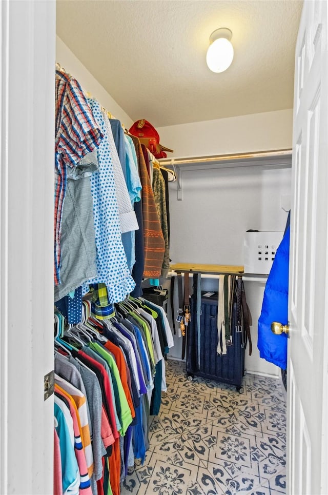5523 Waverdale Ct, Sugar Land, TX 77479 - spacious closet with tile patterned floors