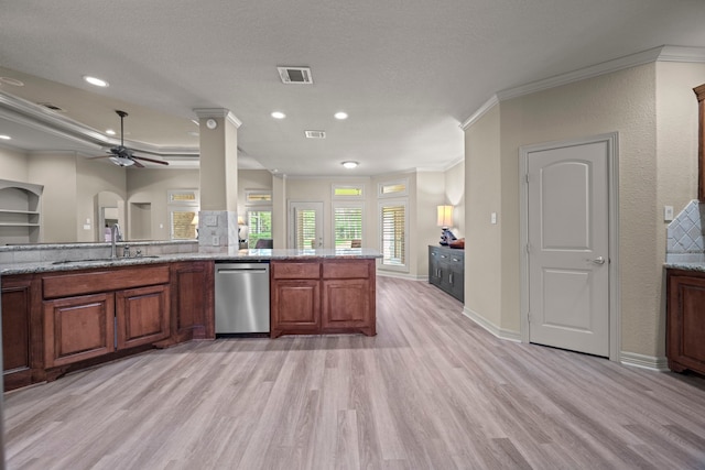 261 Ridge Lake Dr, Montgomery, TX 77316 - kitchen featuring a sink, light wood finished floors, crown molding, light stone counters, and a ceiling fan