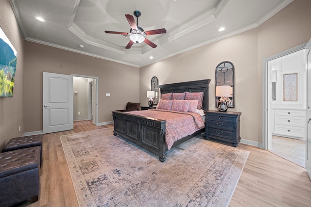 261 Ridge Lake Dr, Montgomery, TX 77316 - bedroom featuring a raised ceiling, light wood-style floors, ornamental molding, baseboards, and recessed lighting