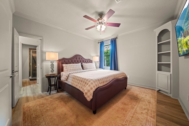 261 Ridge Lake Dr, Montgomery, TX 77316 - bedroom with ornamental molding, wood finished floors, ceiling fan, and baseboards