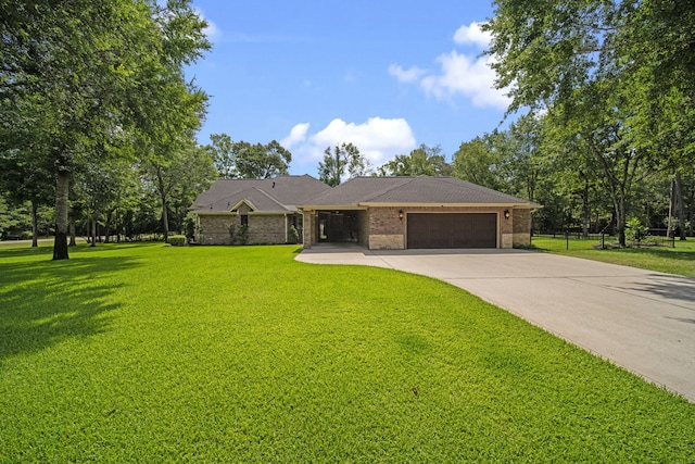261 Ridge Lake Dr, Montgomery, TX 77316 - view of front of home with an attached garage, driveway, brick siding, and a front yard