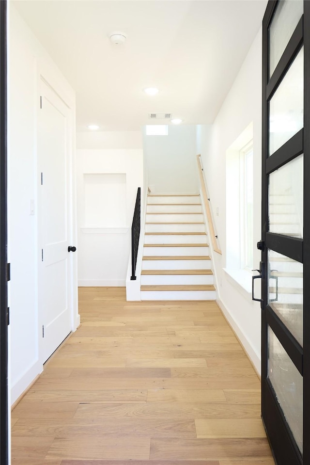 3508 Sauer St, Houston, TX 77004 - stairway with wood finished floors, baseboards, and recessed lighting