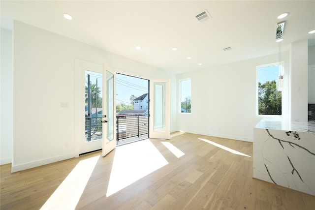 3508 Sauer St, Houston, TX 77004 - unfurnished room featuring plenty of natural light, light wood-type flooring, recessed lighting, and baseboards