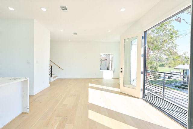 3508 Sauer St, Houston, TX 77004 - empty room with light wood-style floors, recessed lighting, stairs, and baseboards