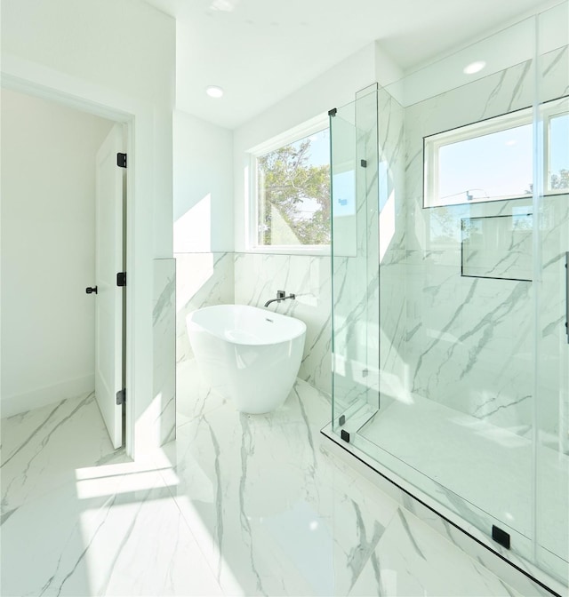 3508 Sauer St, Houston, TX 77004 - bathroom with healthy amount of natural light, a marble finish shower, a freestanding bath, and marble finish flooring