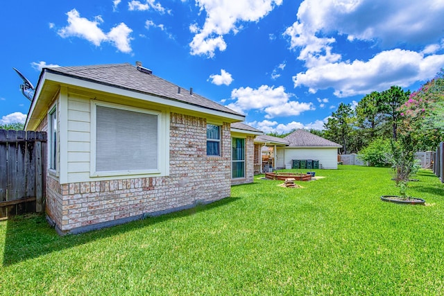 2207 Desert Vine Ct, Sugar Land, TX 77498 - rear view of house with brick siding and roof with shingles