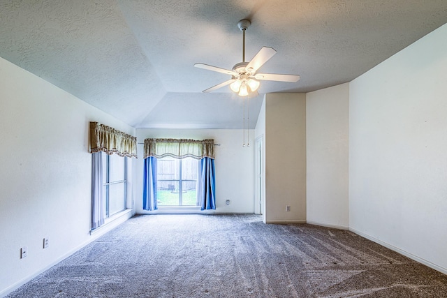 2207 Desert Vine Ct, Sugar Land, TX 77498 - carpeted empty room with ceiling fan, a textured ceiling, baseboards, and lofted ceiling