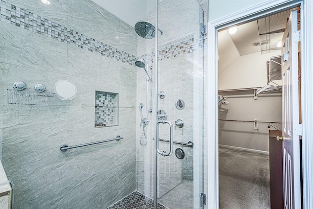 2207 Desert Vine Ct, Sugar Land, TX 77498 - bathroom with a stall shower and a walk in closet