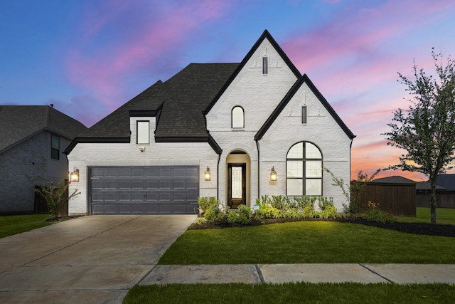 3111 Lantana Trl, Katy, TX 77493 - french provincial home with brick siding, concrete driveway, a yard, a garage, and roof with shingles