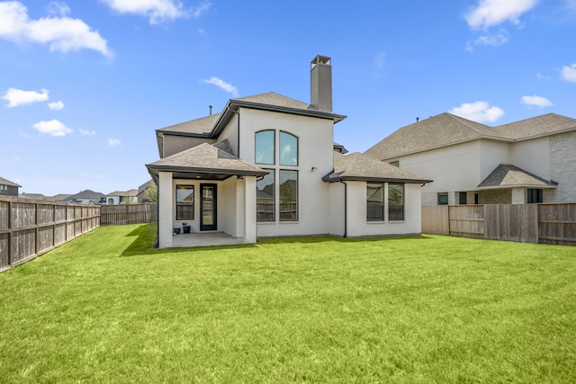 3111 Lantana Trl, Katy, TX 77493 - back of property with a chimney, brick siding, a patio area, and a shingled roof