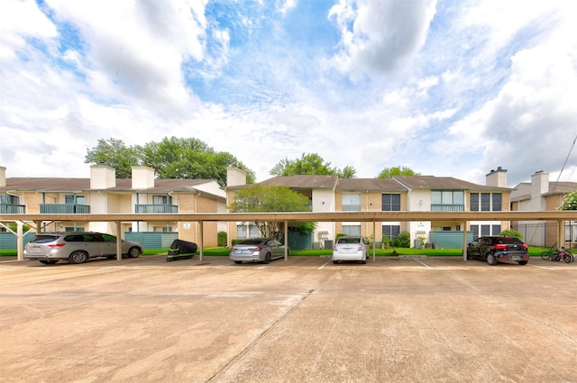 250 El Dorado Blvd Unit 103, Houston, TX 77598 - covered parking lot featuring a residential view