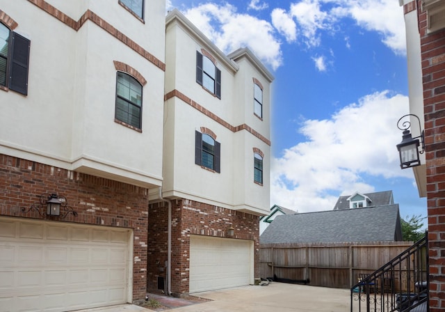 1404 W 26th St Unit C, Houston, TX 77008 - view of property with an attached garage and concrete driveway