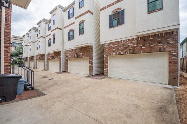 1404 W 26th St Unit C, Houston, TX 77008 - view of building exterior with concrete driveway and an attached garage