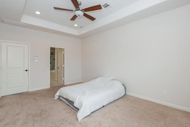 1404 W 26th St Unit C, Houston, TX 77008 - bedroom featuring carpet, a tray ceiling, recessed lighting, baseboards, and ensuite bath