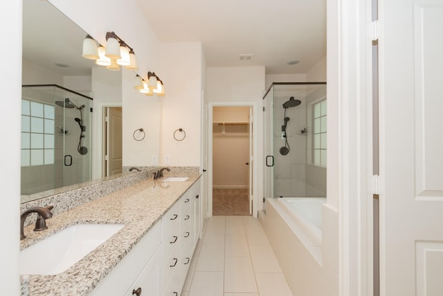 1404 W 26th St Unit C, Houston, TX 77008 - full bathroom with tile patterned flooring, a shower stall, a spacious closet, double vanity, and a bath