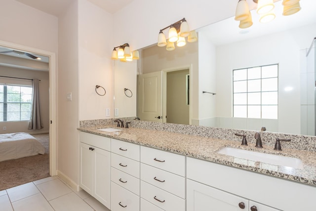 1404 W 26th St Unit C, Houston, TX 77008 - bathroom with a chandelier, double vanity, tile patterned floors, and connected bathroom