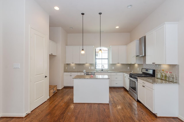 1404 W 26th St Unit C, Houston, TX 77008 - kitchen with stainless steel appliances, wall chimney exhaust hood, a sink, a center island, and dark wood-style flooring