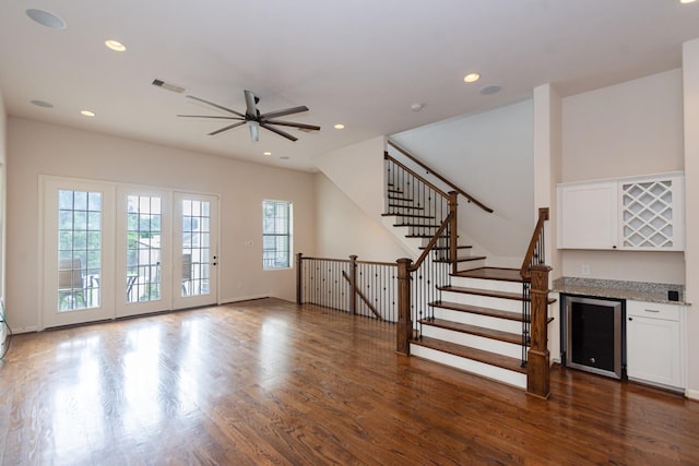 1404 W 26th St Unit C, Houston, TX 77008 - unfurnished living room with beverage cooler, a bar, a ceiling fan, dark wood-style flooring, and recessed lighting