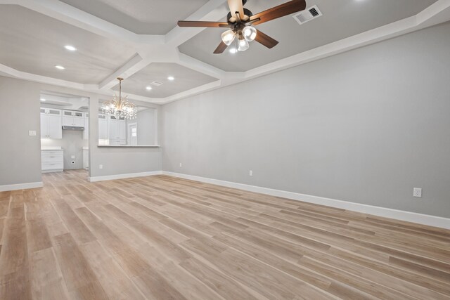 7024 Avenue Ave E, Houston, TX 77011 - unfurnished living room featuring coffered ceiling, recessed lighting, a chandelier, a ceiling fan, and light wood finished floors