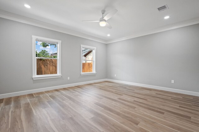 7024 Avenue Ave E, Houston, TX 77011 - unfurnished room featuring crown molding, a ceiling fan, light wood-style flooring, baseboards, and recessed lighting