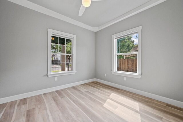 7024 Avenue Ave E, Houston, TX 77011 - empty room featuring plenty of natural light, ceiling fan, baseboards, and light wood-style floors