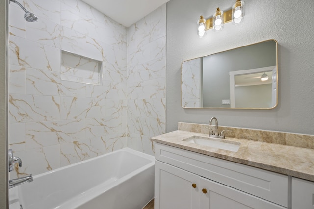 7024 Avenue Ave E, Houston, TX 77011 - full bathroom featuring vanity,  shower combination, and a textured wall