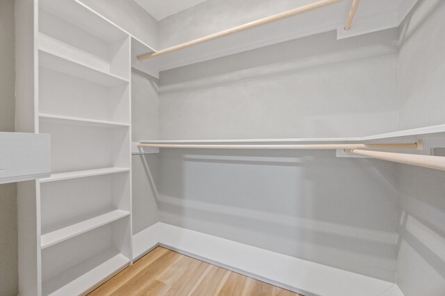 7024 Avenue Ave E, Houston, TX 77011 - walk in closet with wood finished floors
